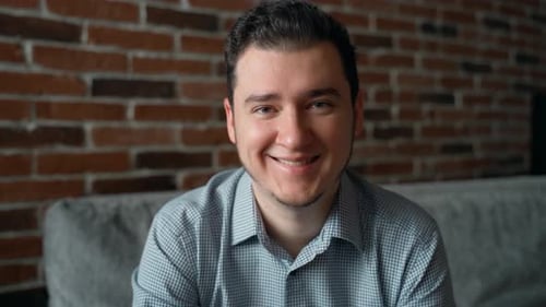 Young Adult Smiling Comfortably Indoors