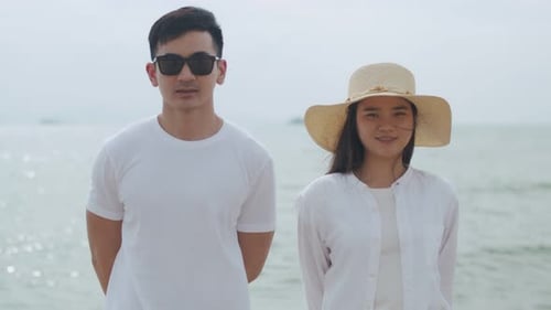 Man and Woman Standing on a Beach