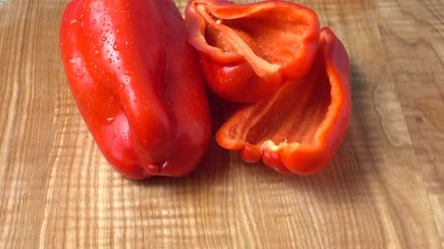 Fresh Red Bell Pepper on Cutting Board
