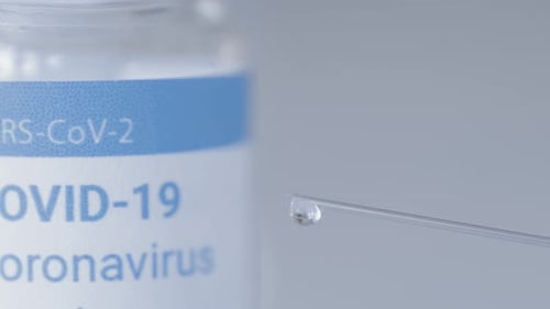 COVID-19 Vaccine Droplet Forming on Needle Tip
