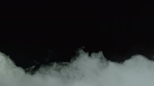 Billowing White Smoke Rising on Black Background