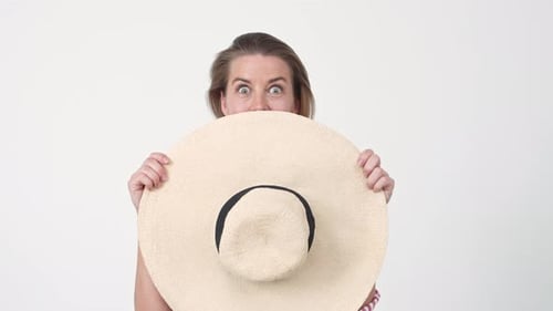 Woman Holding Summer Hat and Posing