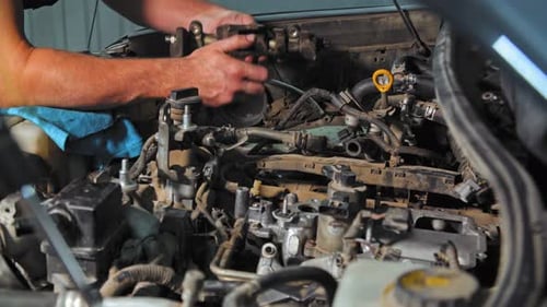 The Mechanic Takes a Detail and Puts It in It Place Under the Hood. (UHD)
