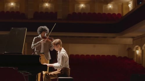 Violin and Piano Duet in Theater Setting