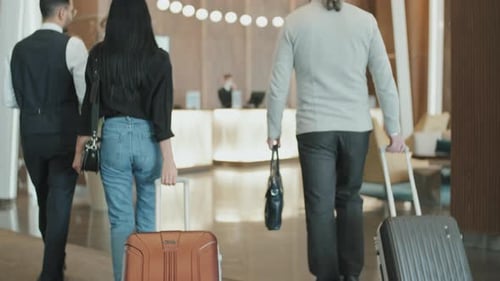 Concierge Escorting Guests to Reception Desk