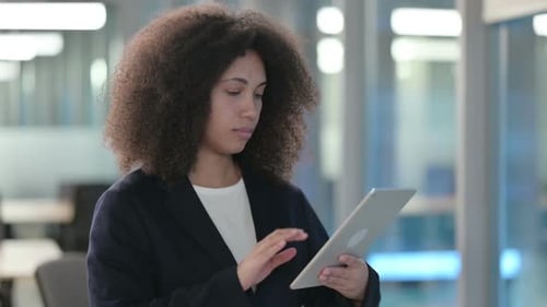 Portrait of African Businesswoman Using Tablet in Office