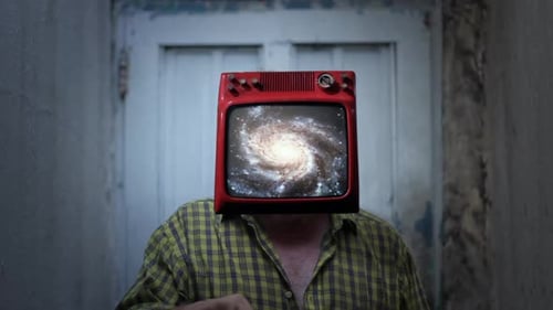 Man with Television Head Showing Swirling Galaxy