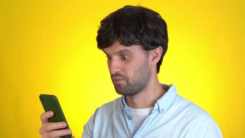 Surprised Man Isolated on Yellow Background Studio