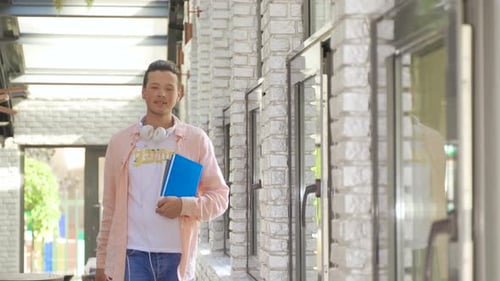 Man Smiling and Walking Toward the Camera