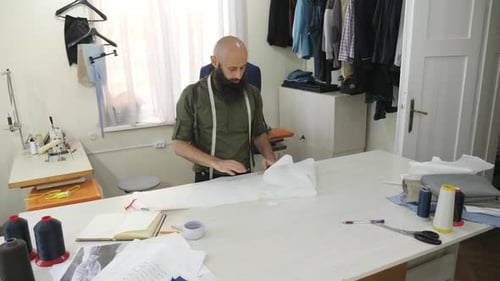 Tailor working with patterns