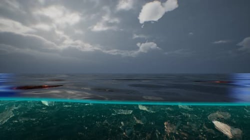 Split View Over and Under Water in the Caribbean Sea with Clouds