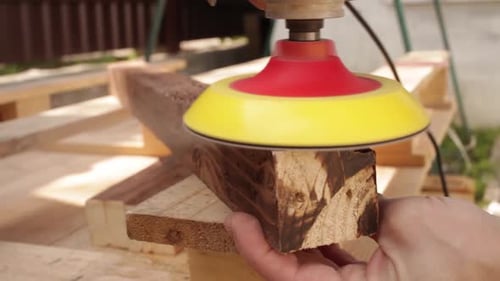 Sanding Wood Plank With Electric Sander Tool