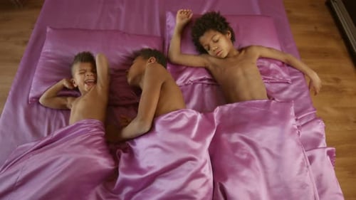 Three Afro Kids Sleeping Together.