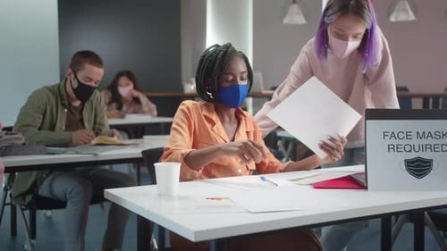 People Check Temperatures in Office During Daytime