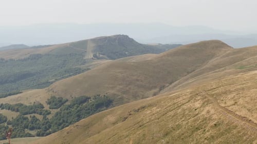 Tilting on mountain ranges of Stara planina 4K 2160p 30fps UltraHD footage - Valley under Midzor p