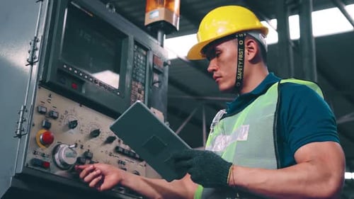 Smart Factory Worker Using Machine in Factory Workshop