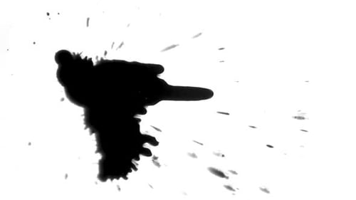 Black Ink Drop Splatters on White Surface
