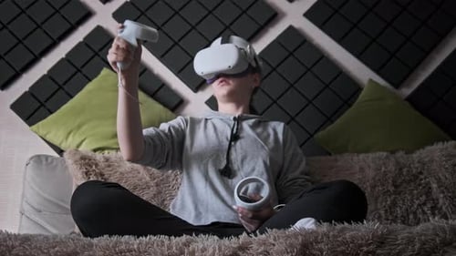 Woman Using Virtual Reality Headset on Couch
