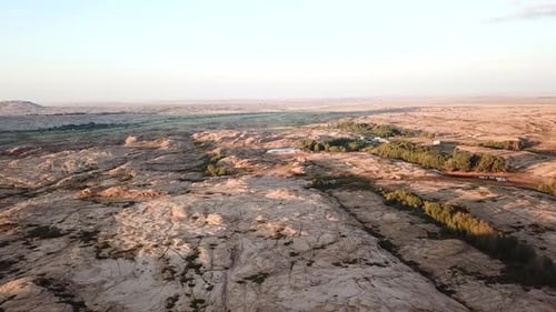 Scenic Aerial View of Desert Landscape at Sunrise