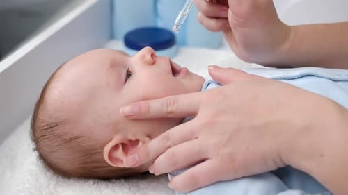 Tiny Infant Receives Nasal Drops at Home