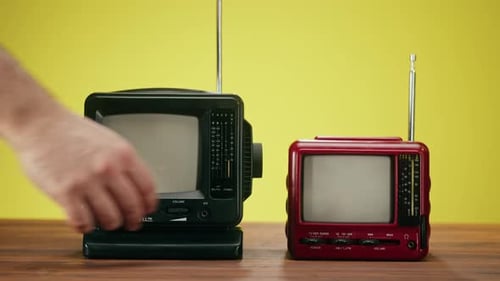Retro Miniature Televisions with Static Screen on Table