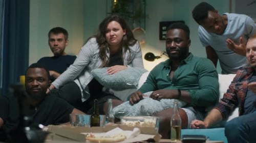 Friends Celebrating a Victory at Home Together