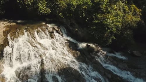Aerial View of Tropical Waterfall Flowing in Nature