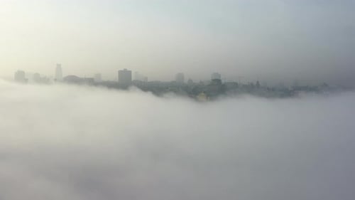 Aerial View of the City in the Fog