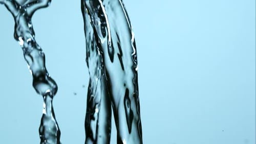 Abstract Water Flowing on Light Blue Background