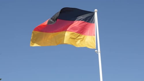 German Flag Waving Against a Clear Sky