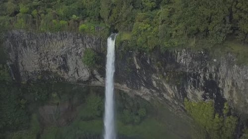 Aerial View of High Waterfall in Lush Nature