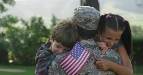 Children Hugging Military Parent in Suburban Yard