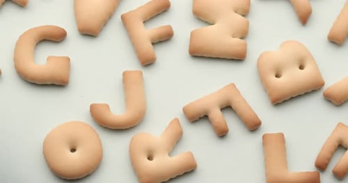 Alphabet Cookies Arranged on a Light Background