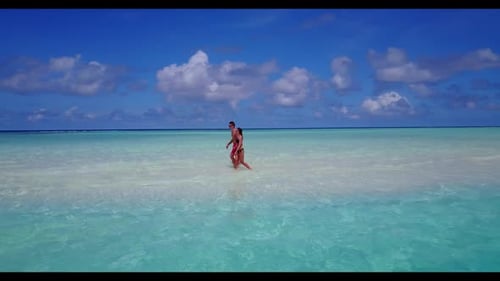 Romantic couple suntan on relaxing resort beach break by blue sea with white sand background of the