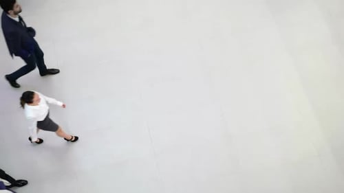 Businesspeople walking in office