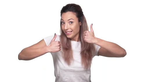 Cheerful Young Woman Gives Double Thumbs Up