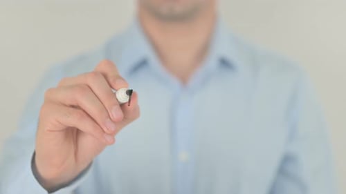 Hand Writing the Word Bargain on Glass