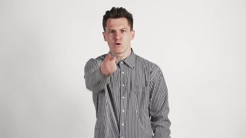 A Young Man of Caucasian Appearance and Angry Swears Directly To the Camera Waving His Hands
