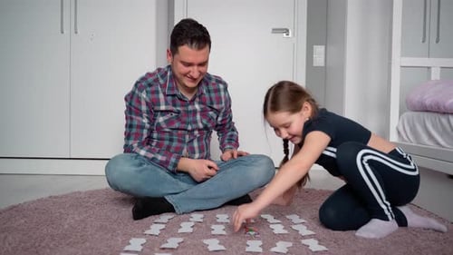Cheerful Father and Daughter Playing Memory Game