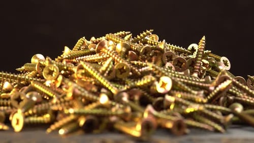 Pile of Golden Screws Close Up View