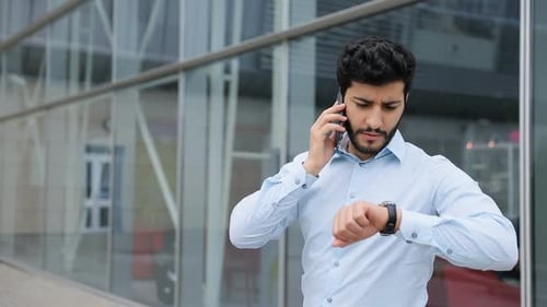 Business Man Talking On Phone Near Office Outdoors