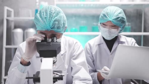 Scientists Working in Lab Analyzing Data