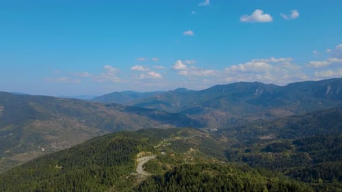 steep green mountains, deep forest and mountain road, beautiful valley