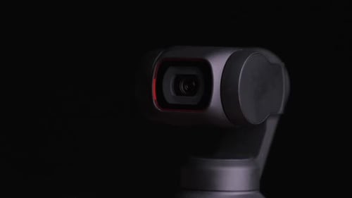 Camera Swivels on Black Background