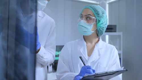 Scientists Discussing Data in a Clean Laboratory