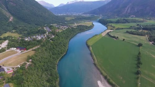 Aerial View of Rural Landscape with Fields and River in Norway