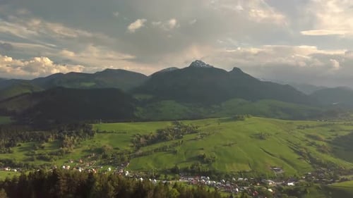 Aerial View of Green Alpine Country in Sunny Spring Nature Landscape