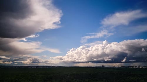 Time-Lapse of Clouds Passing Over Green Forest