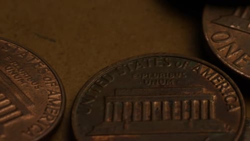 Rotating stock footage shot of American pennies (coin - $0.01) - MONEY 0174