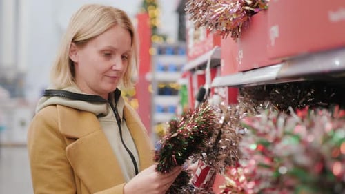 Woman Shopping for Holiday Decorations in a Store